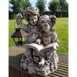 Border Stoneware Boy & Girl With Book